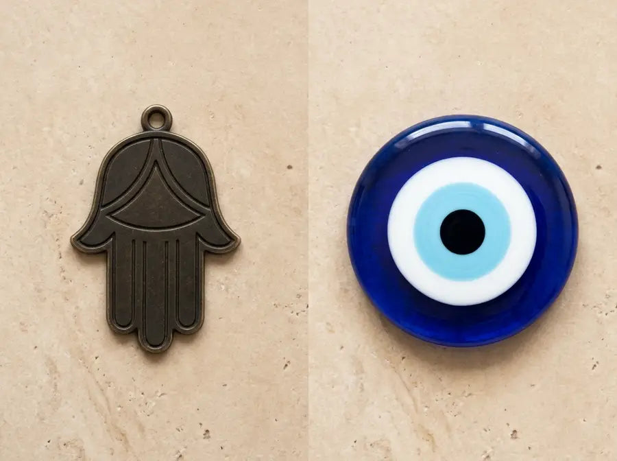 Full Hamsa hand silhouette beside a same-height circular evil eye charm with a dominant blue center.