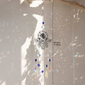 Hamsa suncatcher with blue eye beads and clear pointed drops beside a length marker labeled 44.2 cm and 17.40 in.