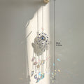Silver tone Hamsa suncatcher with clear crescent moon drops beside a length marker labeled 39 cm and 15.35 in.