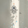 Silver tone Hamsa suncatcher with clear star drops beside a vertical length marker labeled 39 cm and 15.35 in.