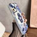 Blue Hamsa and Evil Eye phone case viewed from the opposite side, showing an outlined button and small openings near the lower corner