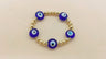 Evil Eye Beaded Bracelet with Blue Discs and Gold Tone Spacers
