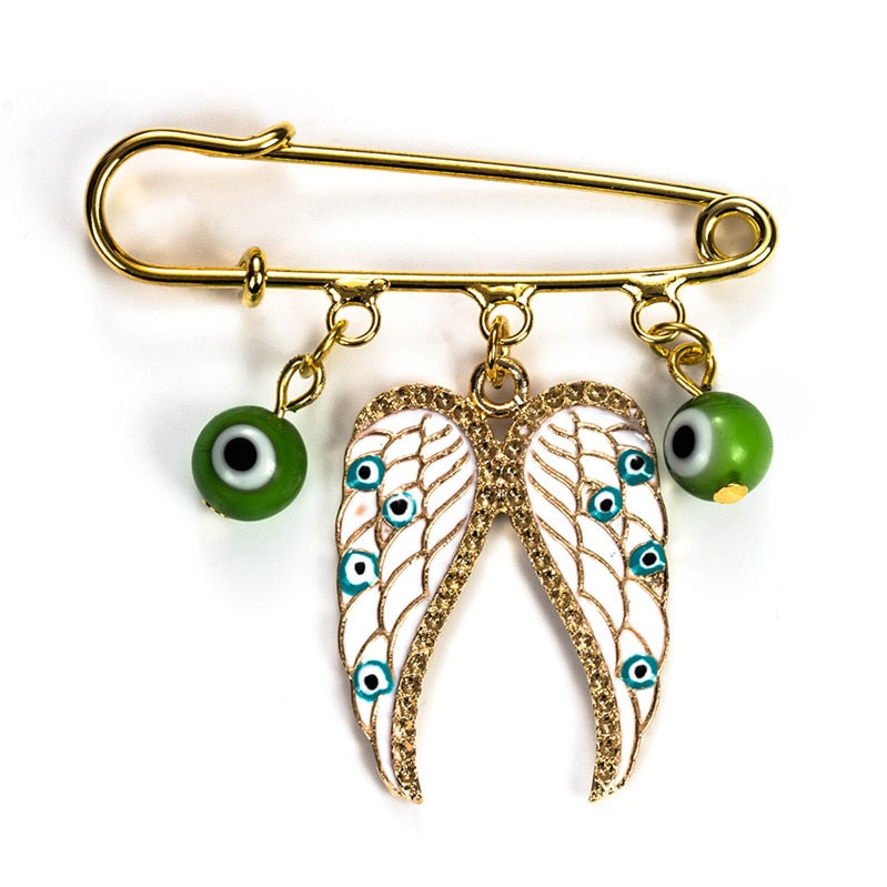 Ward off Bad Luck with our Turkish Evil Eye Brooch Pin with Flower Crown, Hamsa Hand, and Star Charms