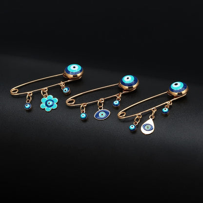 Ward off Bad Luck with our Turkish Evil Eye Brooch Pin with Flower Crown, Hamsa Hand, and Star Charms