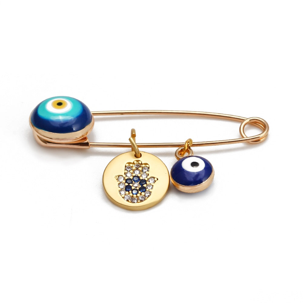 Ward off Bad Luck with our Turkish Evil Eye Brooch Pin with Flower Crown, Hamsa Hand, and Star Charms