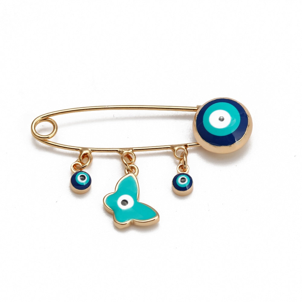 Ward off Bad Luck with our Turkish Evil Eye Brooch Pin with Flower Crown, Hamsa Hand, and Star Charms