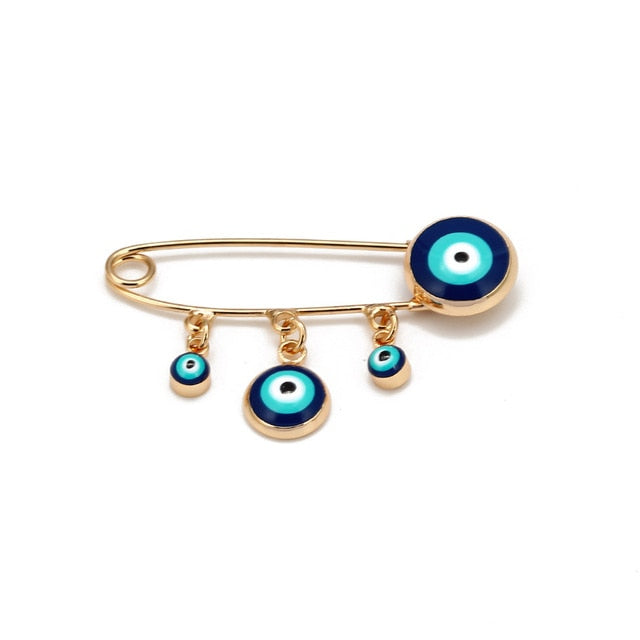 Ward off Bad Luck with our Turkish Evil Eye Brooch Pin with Flower Crown, Hamsa Hand, and Star Charms