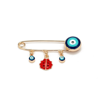 Ward off Bad Luck with our Turkish Evil Eye Brooch Pin with Flower Crown, Hamsa Hand, and Star Charms