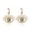 rhinestone evil eye tassel earrings