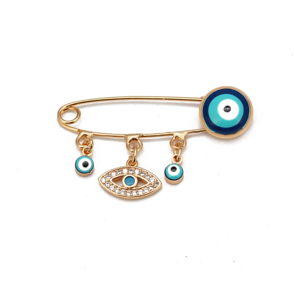 Ward off Bad Luck with our Turkish Evil Eye Brooch Pin with Flower Crown, Hamsa Hand, and Star Charms