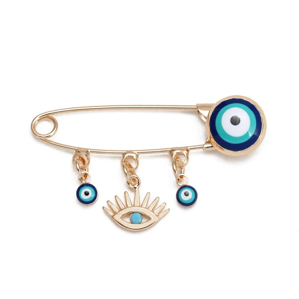 Ward off Bad Luck with our Turkish Evil Eye Brooch Pin with Flower Crown, Hamsa Hand, and Star Charms