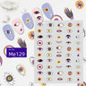 Purple and yellow eye nail sticker sheet with hamsa hands, moons and triangle accents