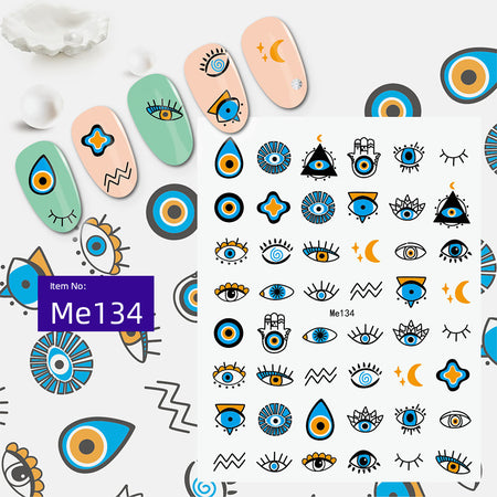 Blue and orange evil eye nail sticker sheet with hamsa, moon and geometric accents