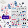 Blue, pink, black and white eye nail sticker sheet with varied lashes and eye shapes