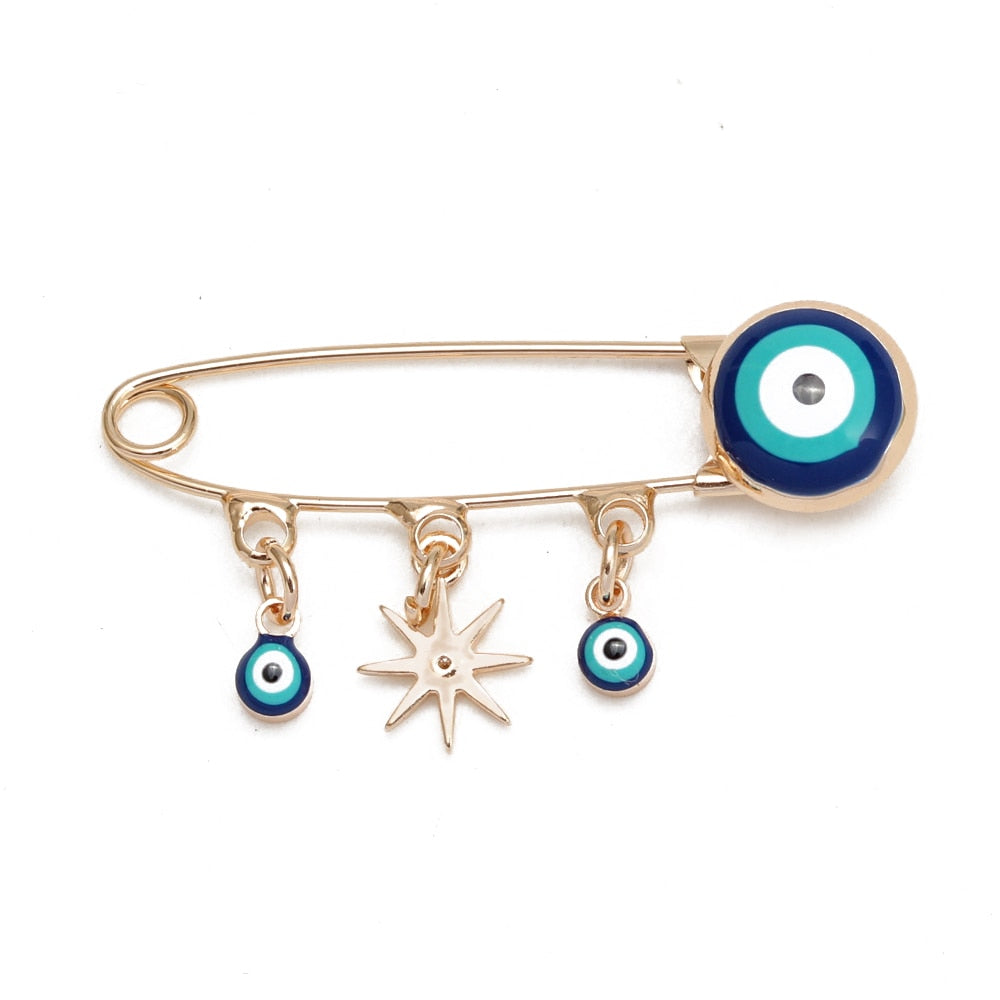 Ward off Bad Luck with our Turkish Evil Eye Brooch Pin with Flower Crown, Hamsa Hand, and Star Charms