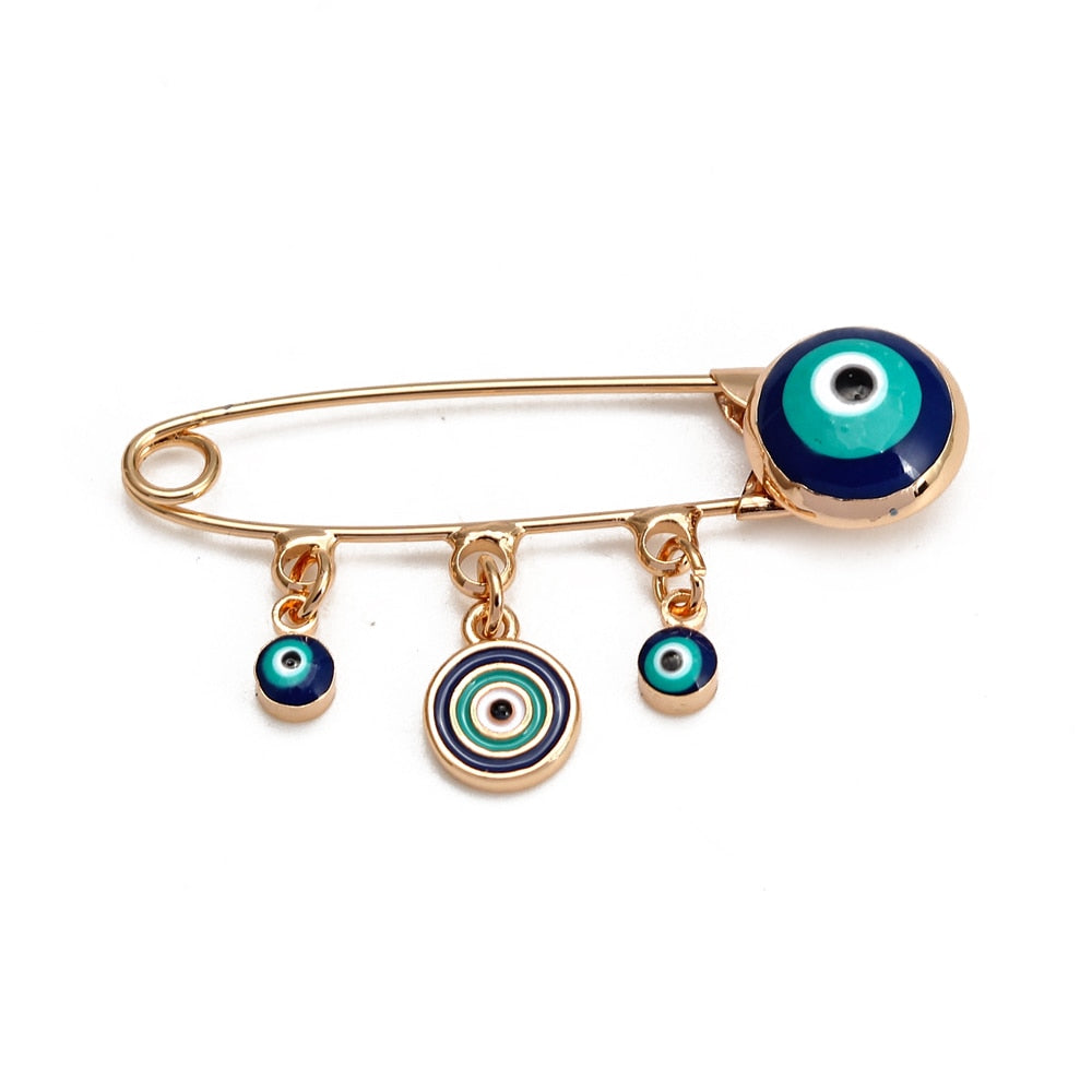 Ward off Bad Luck with our Turkish Evil Eye Brooch Pin with Flower Crown, Hamsa Hand, and Star Charms