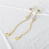 Gold tone evil eye earrings with Hamsa details, extended chains and detached backs