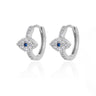 Silver tone evil eye hoop earrings with blue centers and clear accents